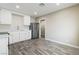 Kitchen featuring stainless steel appliances, white cabinets, and wood-look flooring at 4676 E Alexander Rd, Las Vegas, NV 89115