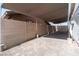 Covered outdoor patio with brick pavers and privacy walls, offering ample space at 4676 E Alexander Rd, Las Vegas, NV 89115