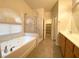 The bathroom features a soaking tub and separate shower at 4717 Mohawk River Ave, North Las Vegas, NV 89031