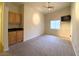 Bright bedroom features a ceiling fan, carpeted flooring, and a wall-mounted television for optimal comfort at 4717 Mohawk River Ave, North Las Vegas, NV 89031
