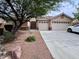 Inviting single-story home with low maintenance desert landscaping, gated front entry, and a two-car garage at 4717 Mohawk River Ave, North Las Vegas, NV 89031
