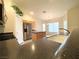 Bright kitchen featuring wooden cabinets, granite countertops, stainless steel appliances, and functional center island at 4717 Mohawk River Ave, North Las Vegas, NV 89031