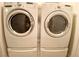 The laundry room features a modern washer and dryer at 4717 Mohawk River Ave, North Las Vegas, NV 89031