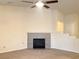 Spacious living room highlighting a cozy fireplace, high ceilings, and neutral color scheme at 4717 Mohawk River Ave, North Las Vegas, NV 89031
