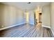 Large bedroom with wood flooring, neutral paint, and access to an ensuite bathroom, providing comfort and style at 4805 Nara Vista Way # 203, Las Vegas, NV 89103