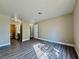 Spacious bedroom with wood floors that connect to a bathroom and laundry area in a well-lit space at 4805 Nara Vista Way # 203, Las Vegas, NV 89103
