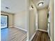 Hallway with a washer and dryer combo leading to a balcony featuring a view of community trees at 4805 Nara Vista Way # 203, Las Vegas, NV 89103