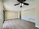 Spacious living room boasts wood flooring and neutral tones, leading to various areas of the home at 4805 Nara Vista Way # 203, Las Vegas, NV 89103