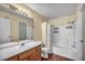 Full bathroom with a tub/shower combo, a single sink vanity, and wood vinyl flooring at 5024 Starfinder Ave, Las Vegas, NV 89108