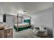This bedroom features a canopy bed with green velvet accents and modern furnishings at 5024 Starfinder Ave, Las Vegas, NV 89108
