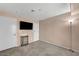 Bedroom with two doors, television mounted on the wall, and carpeted floor at 5024 Starfinder Ave, Las Vegas, NV 89108