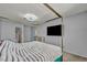 Bedroom featuring a plush bed, television, and light-colored walls at 5024 Starfinder Ave, Las Vegas, NV 89108