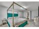 Comfortable bedroom with a four-poster bed and modern décor at 5024 Starfinder Ave, Las Vegas, NV 89108
