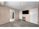 Bedroom with TV, carpet and view to en-suite bathroom with patterned shower curtain at 5024 Starfinder Ave, Las Vegas, NV 89108
