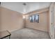 Bedroom with large window, carpet, and natural lighting with corner lamp at 5024 Starfinder Ave, Las Vegas, NV 89108