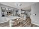 View of the dining area connected to kitchen and living room, enhanced by wood flooring and contemporary décor at 5024 Starfinder Ave, Las Vegas, NV 89108
