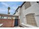 Exterior facade of mediterranean-style townhouse with driveway and tiled roof at 5024 Starfinder Ave, Las Vegas, NV 89108