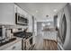 Well-lit kitchen equipped with stainless appliances and white cabinetry at 5024 Starfinder Ave, Las Vegas, NV 89108
