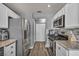 Open kitchen design with stainless appliances and ample counter space at 5024 Starfinder Ave, Las Vegas, NV 89108