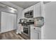 Modern kitchen featuring stainless steel appliances and ample cabinet space at 5024 Starfinder Ave, Las Vegas, NV 89108