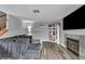 Comfortable living room with fireplace, modern decor, and hardwood floors at 5024 Starfinder Ave, Las Vegas, NV 89108