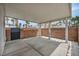 View of enclosed patio with brick wall and views of community palm trees at 5024 Starfinder Ave, Las Vegas, NV 89108
