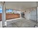 Cozy, covered patio with room for seating and privacy wall is great for entertaining at 5024 Starfinder Ave, Las Vegas, NV 89108