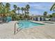 Community pool and spa surrounded by lush landscaping and lounging areas at 5024 Starfinder Ave, Las Vegas, NV 89108