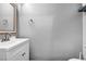 Simple half bath with a bright vanity, chrome fixtures, and neutral paint at 5024 Starfinder Ave, Las Vegas, NV 89108