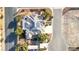 An aerial view features a home with solar panels, shed, patio, and landscaping on a corner lot at 5193 N Miller Ln, Las Vegas, NV 89149