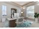 Stylish home office with modern furnishings and ample natural light at 5193 N Miller Ln, Las Vegas, NV 89149