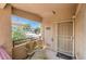 Enclosed patio with seating and a view of neighborhood trees at 520 Arrowhead Trl # 522, Henderson, NV 89015