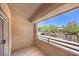 A balcony with a view of trees and a street at 520 Arrowhead Trl # 522, Henderson, NV 89015