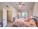 Cozy bedroom with natural light, a ceiling fan, and access to a balcony at 520 Arrowhead Trl # 522, Henderson, NV 89015