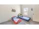 A bedroom has two beds with dinosaur themes, a window and white walls at 520 Arrowhead Trl # 522, Henderson, NV 89015