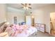 Bright bedroom with neutral walls, ceiling fan, and ample space for a comfortable living at 520 Arrowhead Trl # 522, Henderson, NV 89015