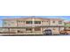 Condo building featuring covered parking with well-maintained landscaping at 520 Arrowhead Trl # 522, Henderson, NV 89015