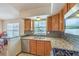 Kitchen with granite countertops, stainless steel appliances, and tile backsplash at 520 Arrowhead Trl # 522, Henderson, NV 89015