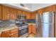 Kitchen with stainless steel appliances including a gas range, microwave and a refrigerator at 520 Arrowhead Trl # 522, Henderson, NV 89015