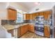Bright kitchen featuring granite countertops, stainless appliances, and plenty of cabinet space at 520 Arrowhead Trl # 522, Henderson, NV 89015
