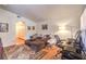 Comfortable living room with a sectional sofa and a desk setup at 520 Arrowhead Trl # 522, Henderson, NV 89015
