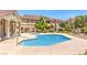 Community swimming pool surrounded by ample lounge seating at 520 Arrowhead Trl # 522, Henderson, NV 89015