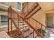 Exterior staircase with metal railings leading to upper-level condos at 520 Arrowhead Trl # 522, Henderson, NV 89015