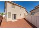 Low maintenance backyard featuring a sliding glass door, and a white fence at 5402 Shady Lair Ct, North Las Vegas, NV 89031