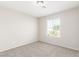 Bedroom featuring neutral walls and a view of a palm tree at 5402 Shady Lair Ct, North Las Vegas, NV 89031