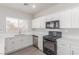 Bright kitchen featuring stainless steel appliances, white cabinetry, and a modern design at 5402 Shady Lair Ct, North Las Vegas, NV 89031