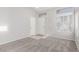 Bright living room with neutral paint, tiled entryway, and carpet flooring at 5402 Shady Lair Ct, North Las Vegas, NV 89031