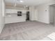 Open concept living area with connecting kitchen, sleek black appliances and eat-in breakfast bar at 5402 Shady Lair Ct, North Las Vegas, NV 89031