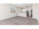 Open living area showcasing modern kitchen with eat-in breakfast bar, with carpet floors at 5402 Shady Lair Ct, North Las Vegas, NV 89031
