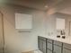 This bathroom features a modern vanity with double sinks and a large mirror at 5888 Becklow Gardens Ave, Las Vegas, NV 89141